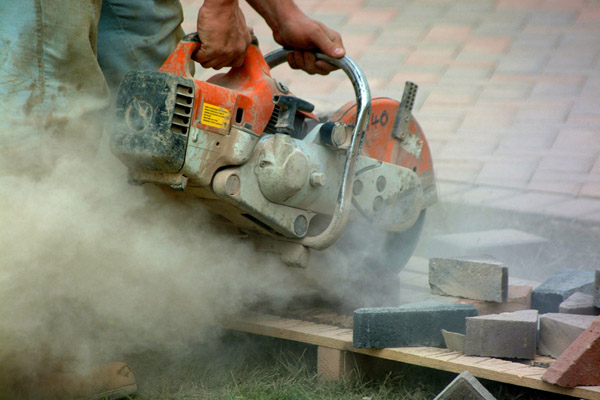 Cement Worker with Saw